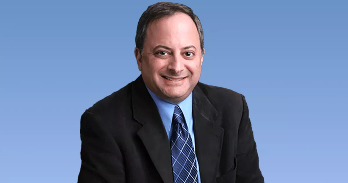 Attorney Steven F. Bliss Esq. in front of a blue background. He is promoting his legal services as: Probate, Trusts, Estate Planning & Bankruptcy.